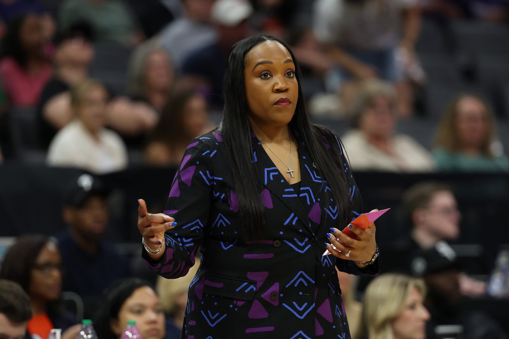 Amaka Agugua-Hamilton, former basketball coach, says she reached settlement with UVA