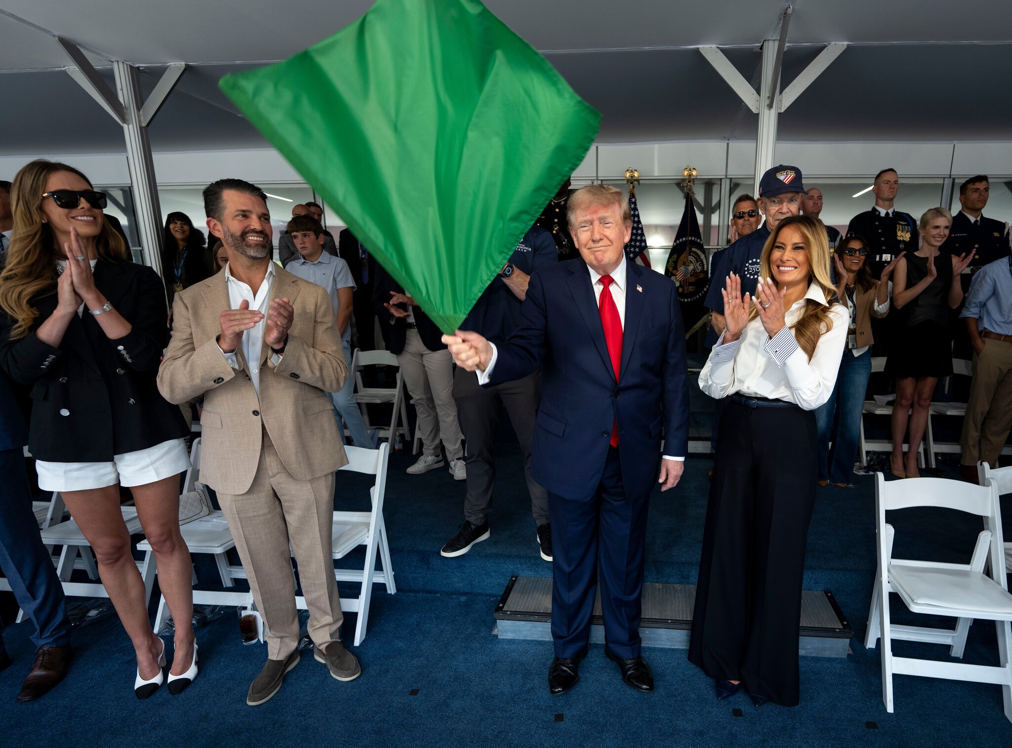 Trump waves the green flag to start the IndyCar race as drivers zoom through Washington’s streets