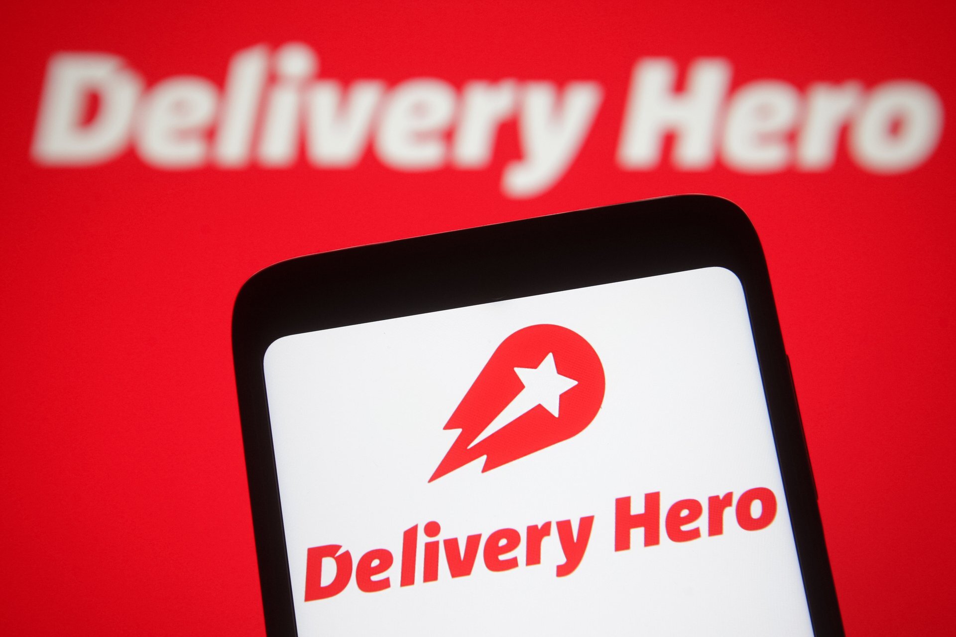 Delivery Hero raised its full-year forecast as growth accelerated ahead of Uber takeover