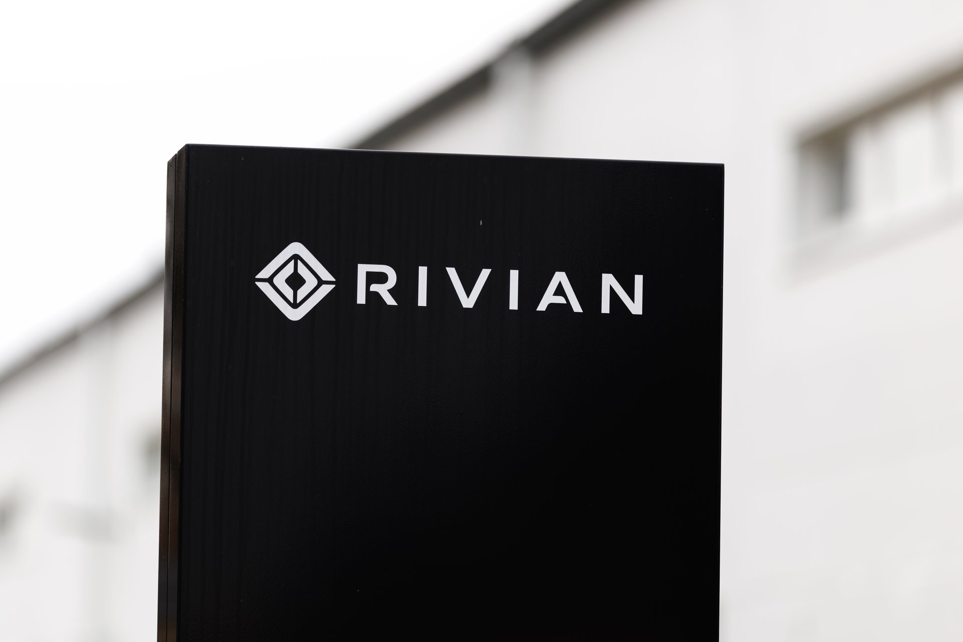 Rivian topped its delivery forecast and raised its full-year outlook as the R2 SUV launched