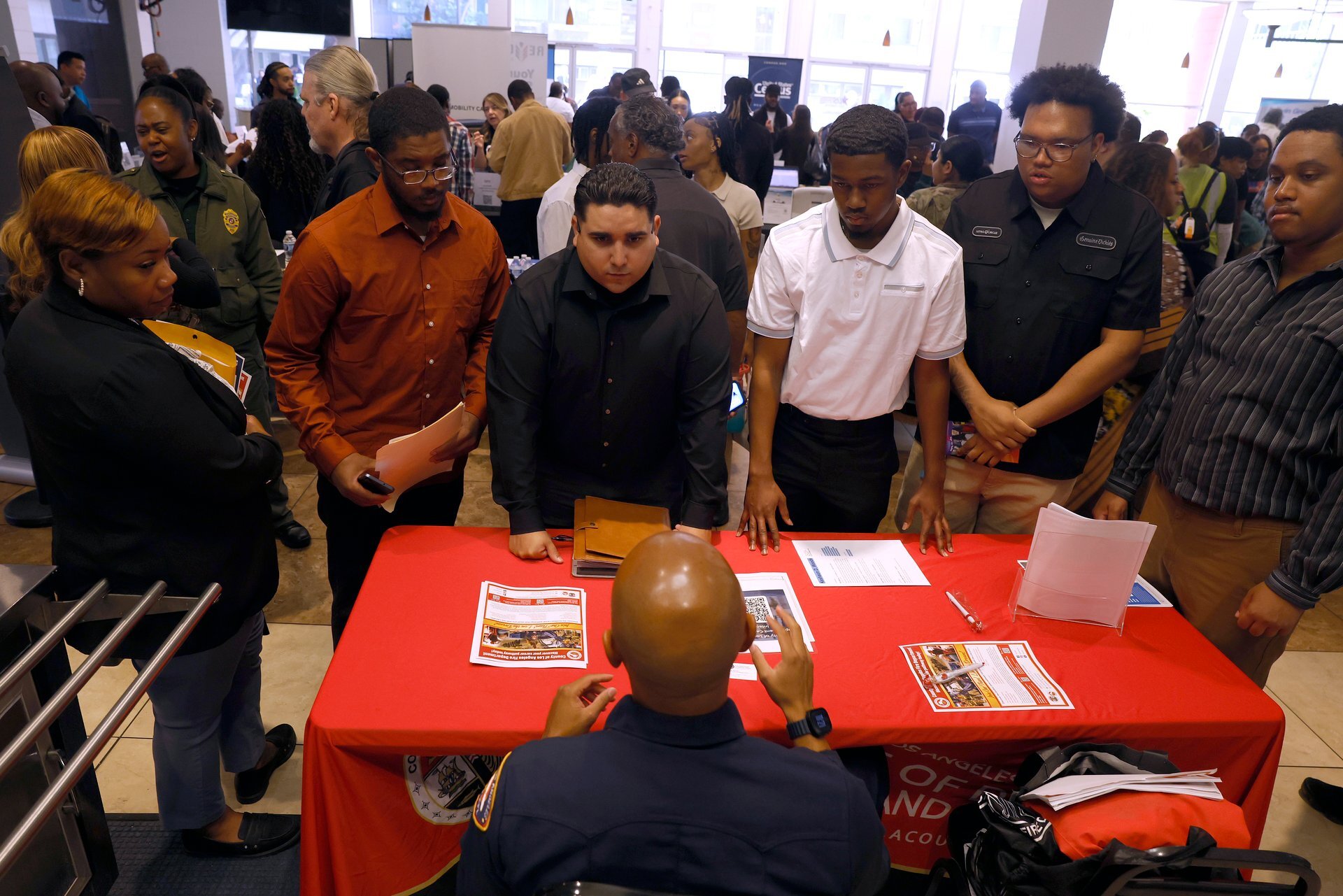Weekly jobless claims rose to 199,000 but stayed historically low, coming in below forecasts