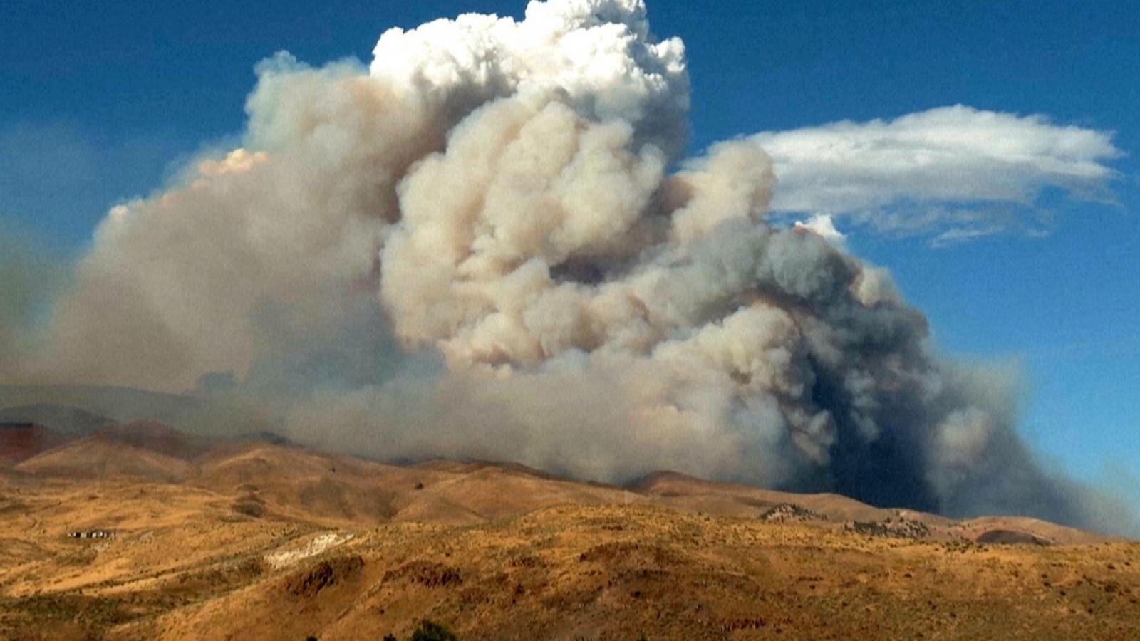 Firefighters are trying to stop a fast-moving Nevada wildfire from spreading to homes in Reno