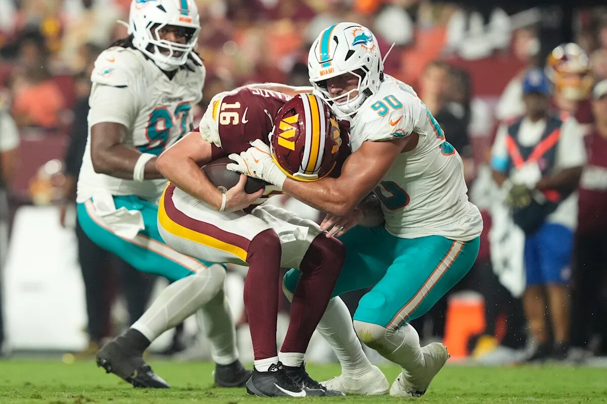 Commanders beat Dolphins 20-7 as Marcus Mariota leaves with a leg injury