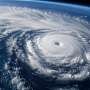 How atmospheric dryness limits increases in typhoon rainfall