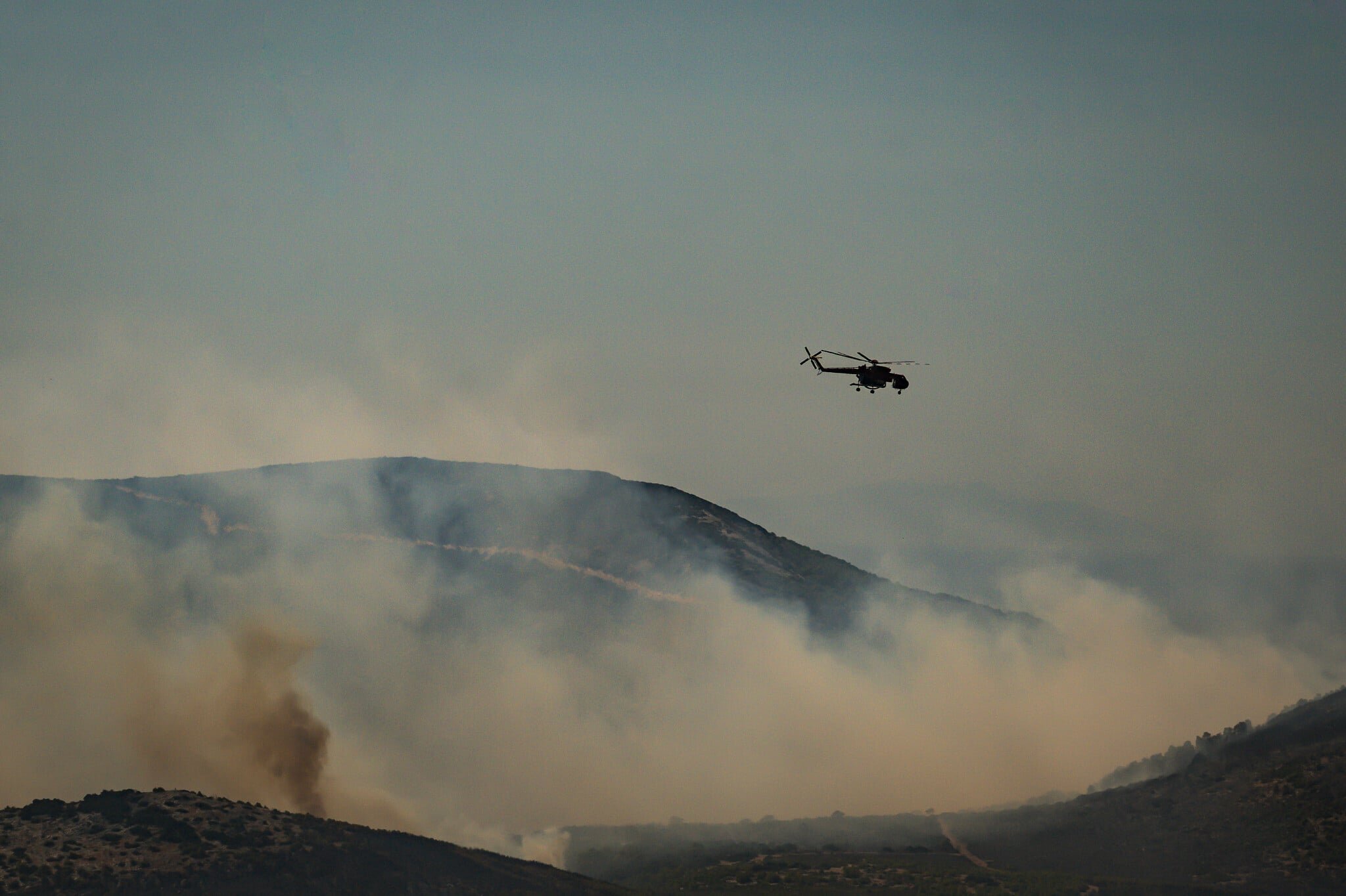 Two dead, hundreds evacuated from fires on island near Athens