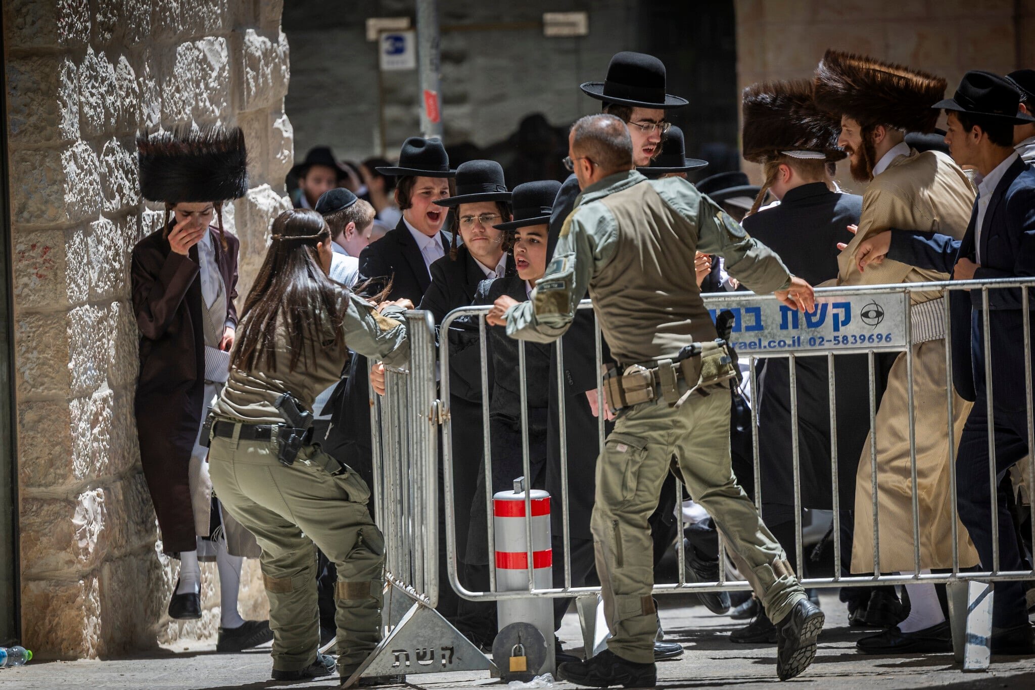 Haredi protesters clash with secular patrons at Jerusalem cafe open on Shabbat