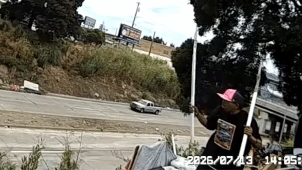 Terrifying moment spear-wielding man lunges at California cops before shots ring out