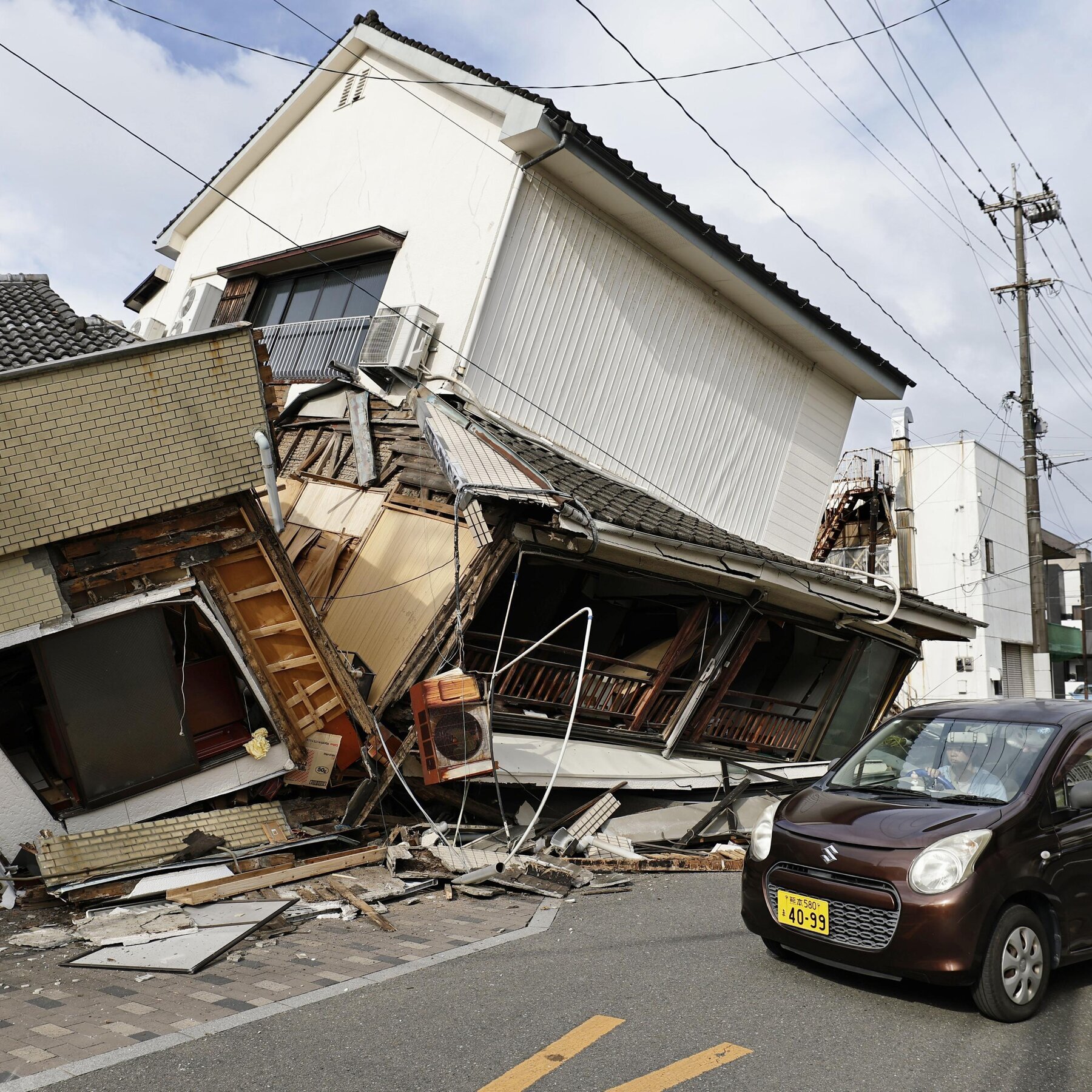 Japan Races to Reach People Trapped After Earthquake Kills at Least 13