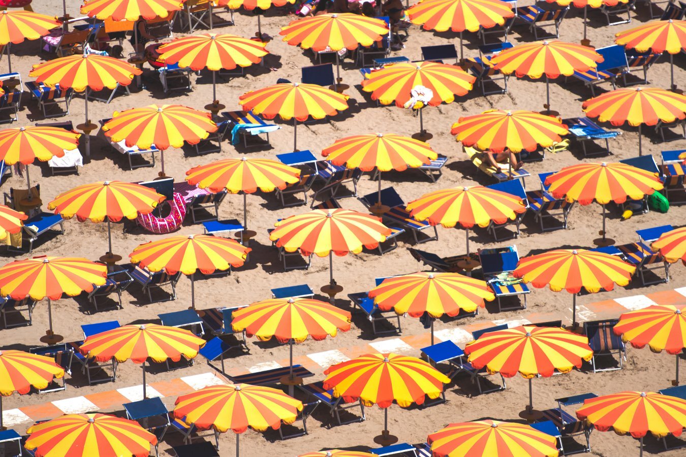 Why sitting under a parasol is barely cooler than being in the sun