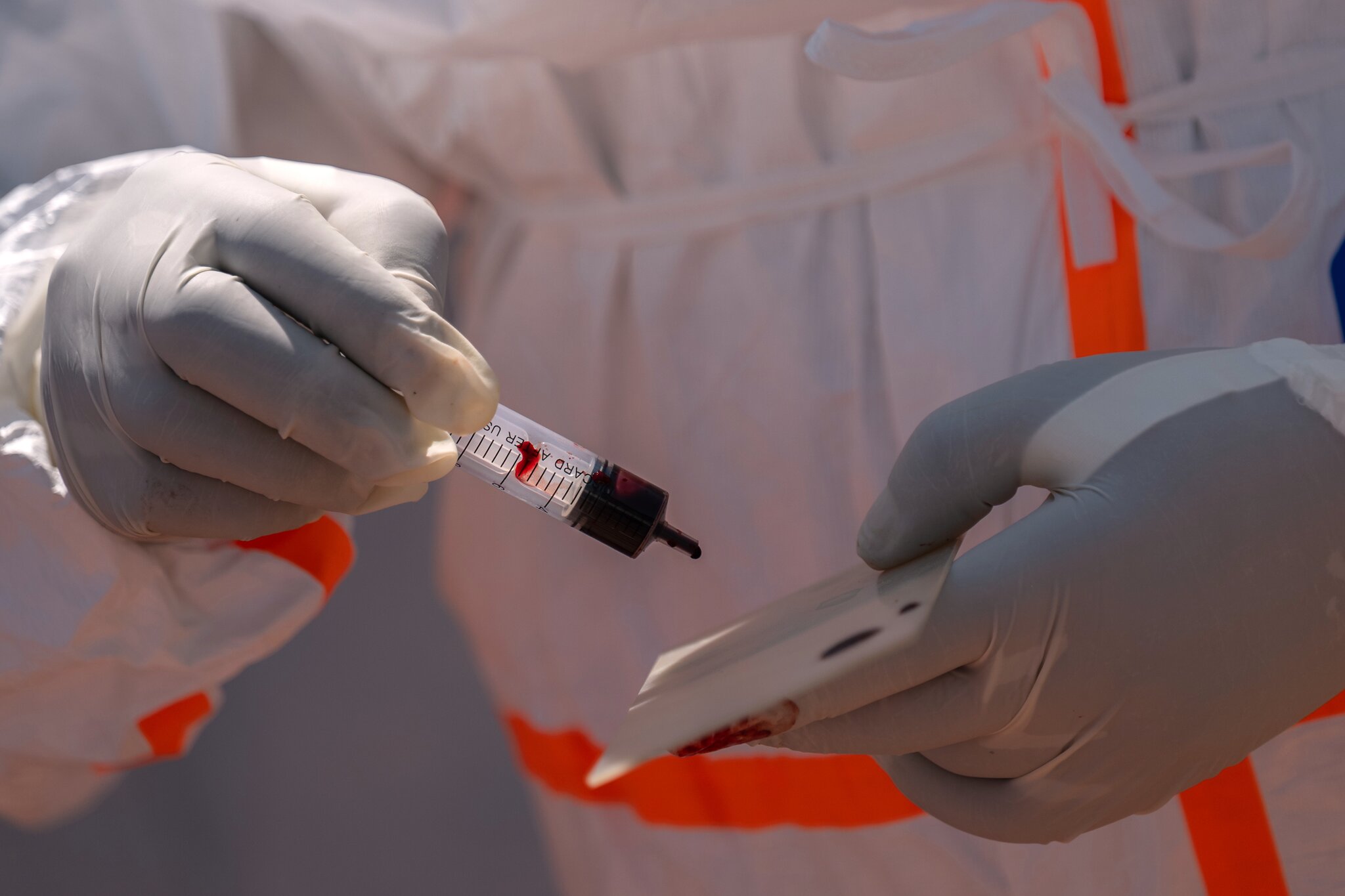 Ebola outbreak nears milestone, while a vaccine remains months away